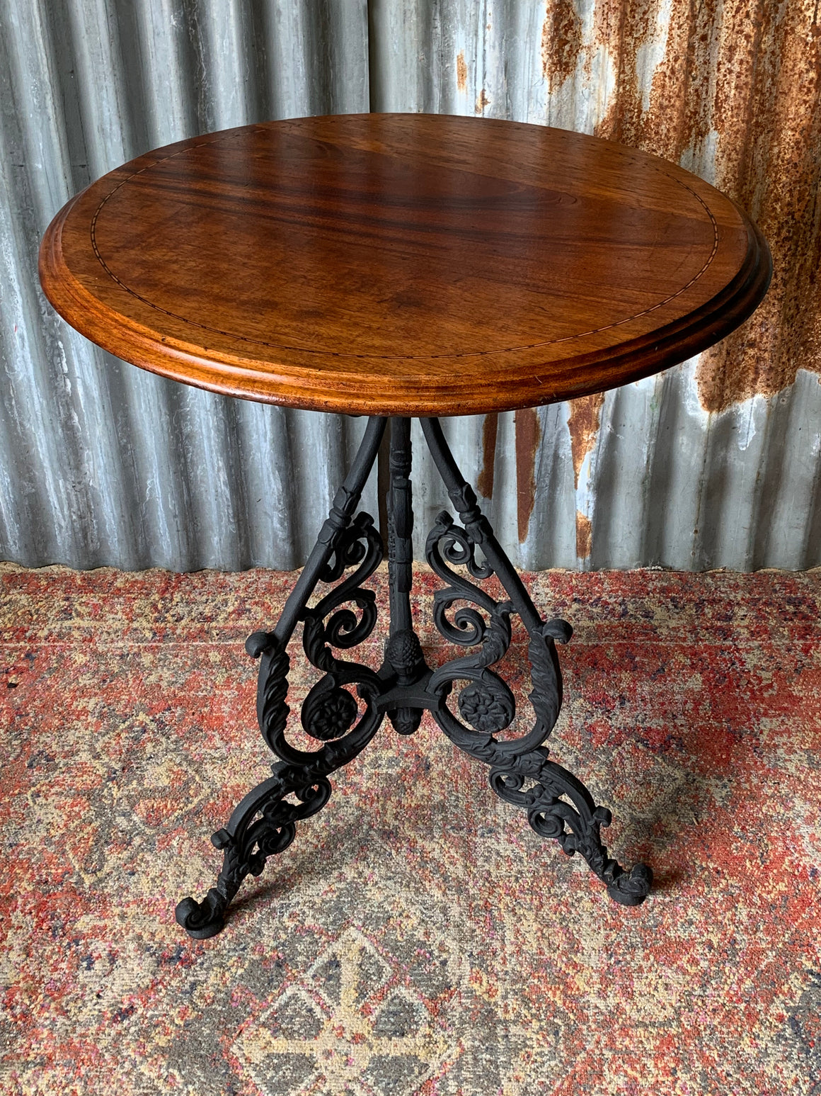 A black cast iron pub table
