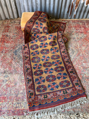 A long yellow ground red blue Persian runner rug ~ 257cm x 67cm