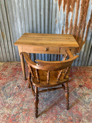 A Victorian oak table with single drawer