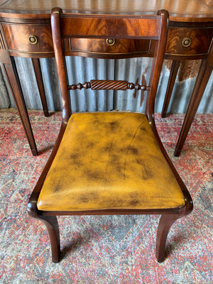 A serpentine desk and leather chair by Bevan Funnell