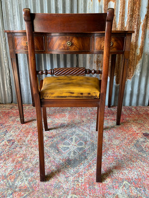 A serpentine desk and leather chair by Bevan Funnell