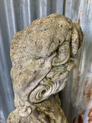 A cast stone garden statue of Guanyin