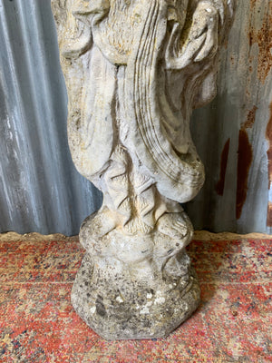 A cast stone garden statue of Guanyin