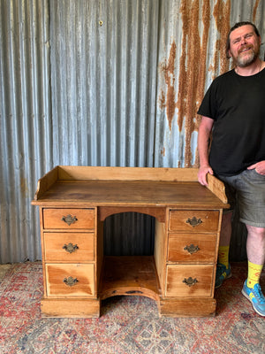 A pine clerk's desk with galleried top