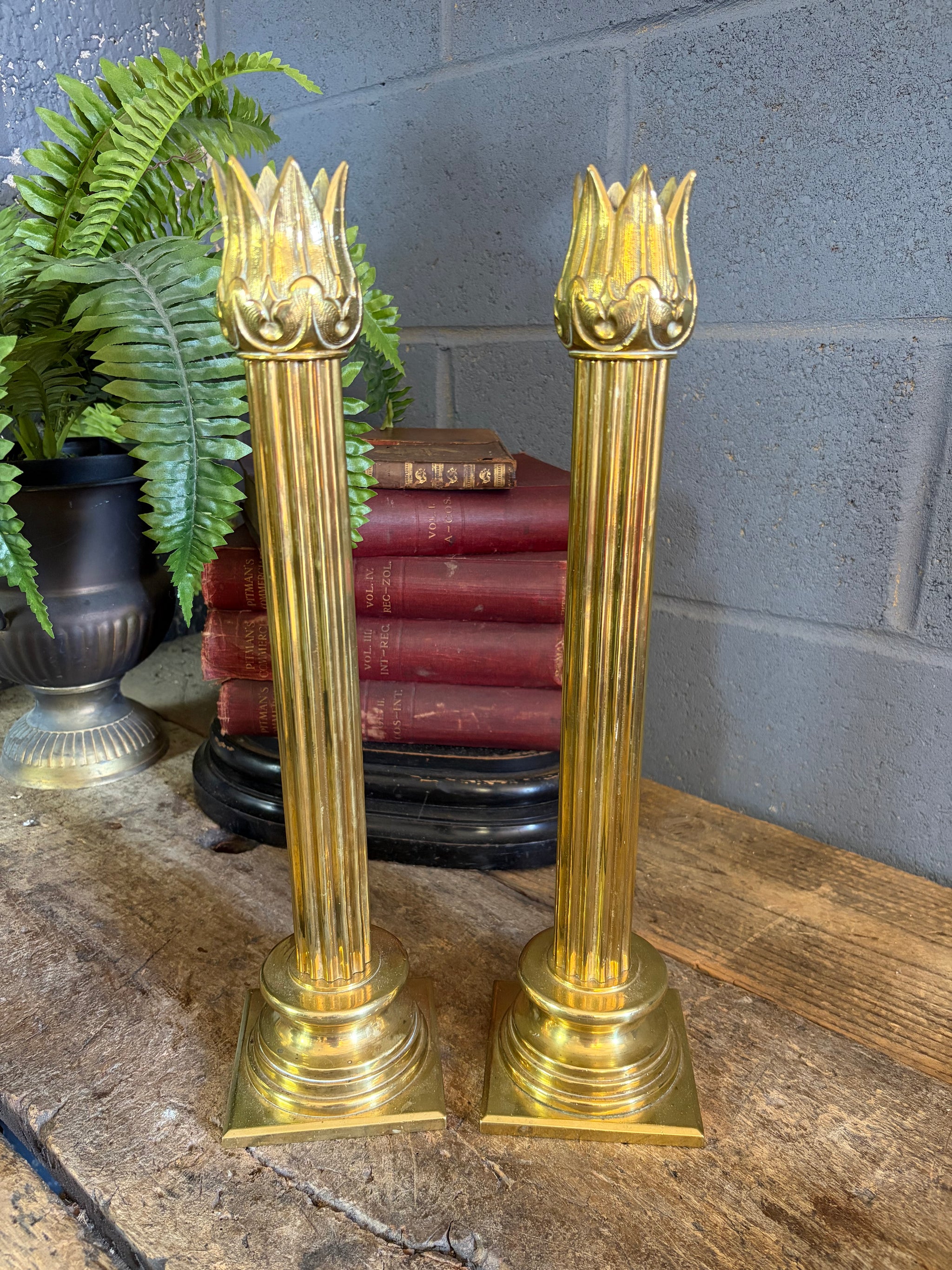 A large pair of ecclesiastical candlesticks