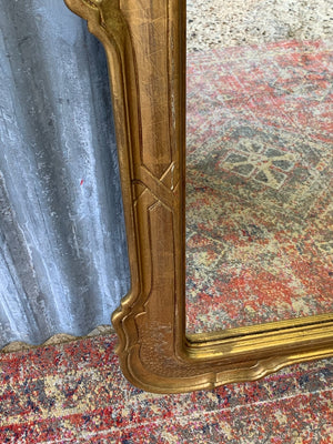 A large giltwood wall mirror