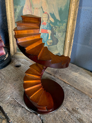 A wooden spiral staircase model