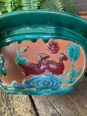 A large Chinese green glaze clay jardiniere