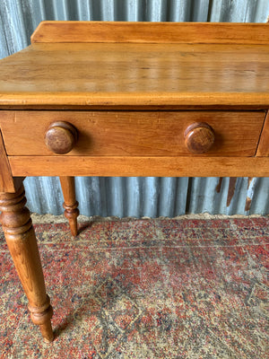 A pine two-drawer desk