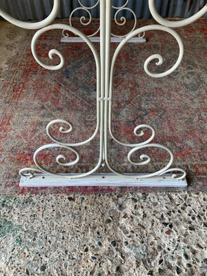A white garden table and chairs set
