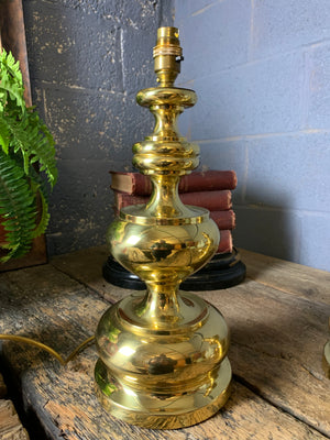 A pair of baluster form brass lamps