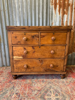 A pine chest of two over two drawers