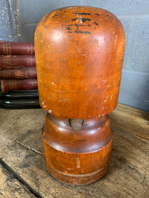 A wooden millinery hat stretcher