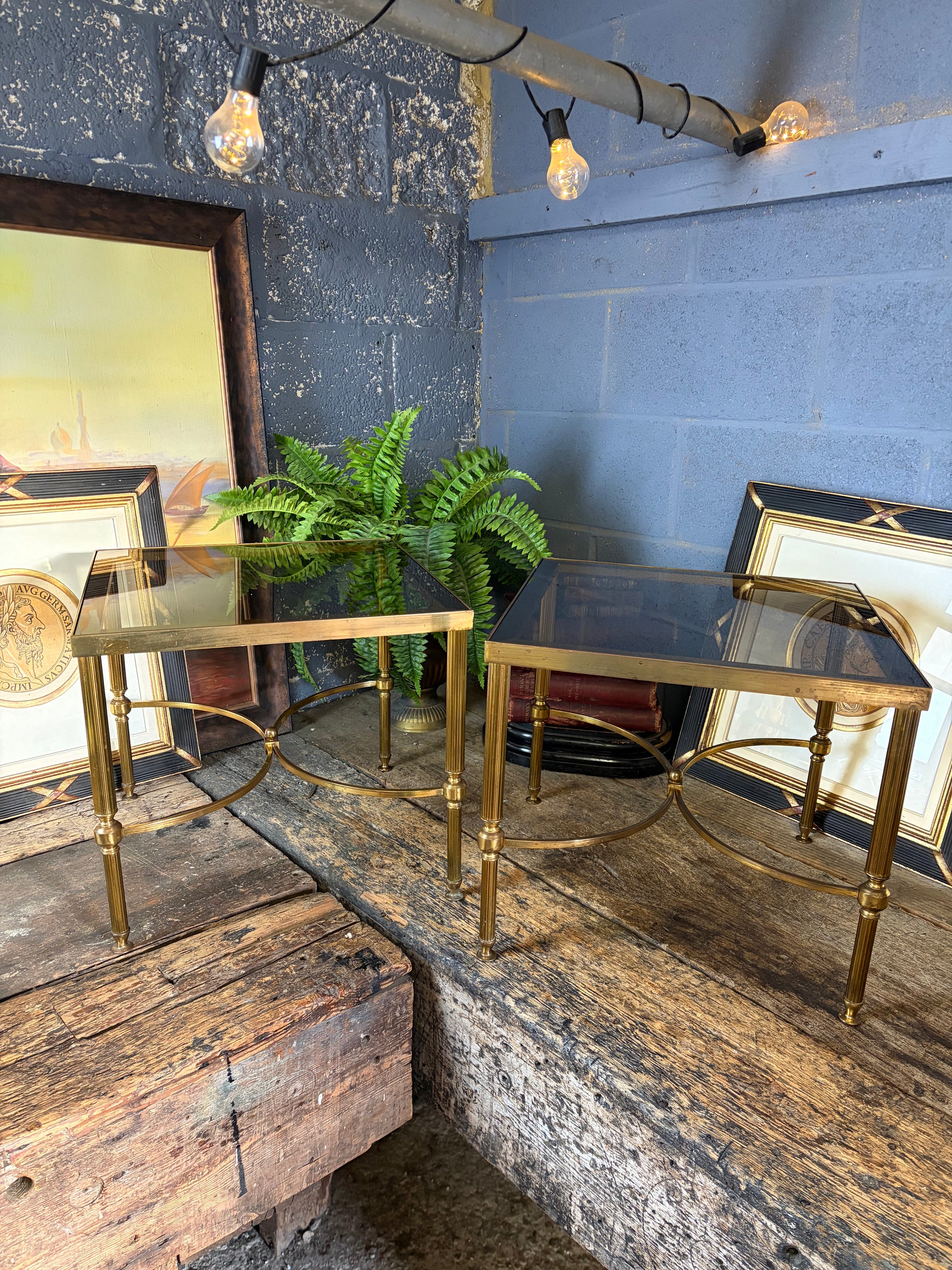A pair of brass and glass Hollywood Regency side tables