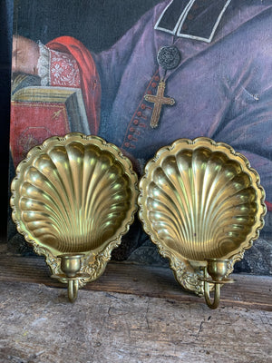 A pair of large brass shell candlestick wall sconces