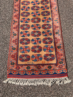 A long yellow ground red blue Persian runner rug ~ 257cm x 67cm