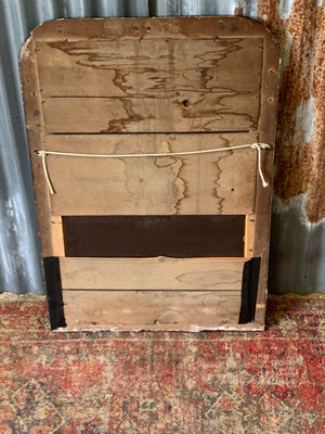 A large French black and gold mirror