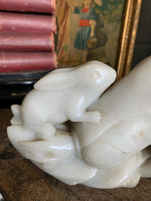 A Chinese stone sculpture depicting rabbits