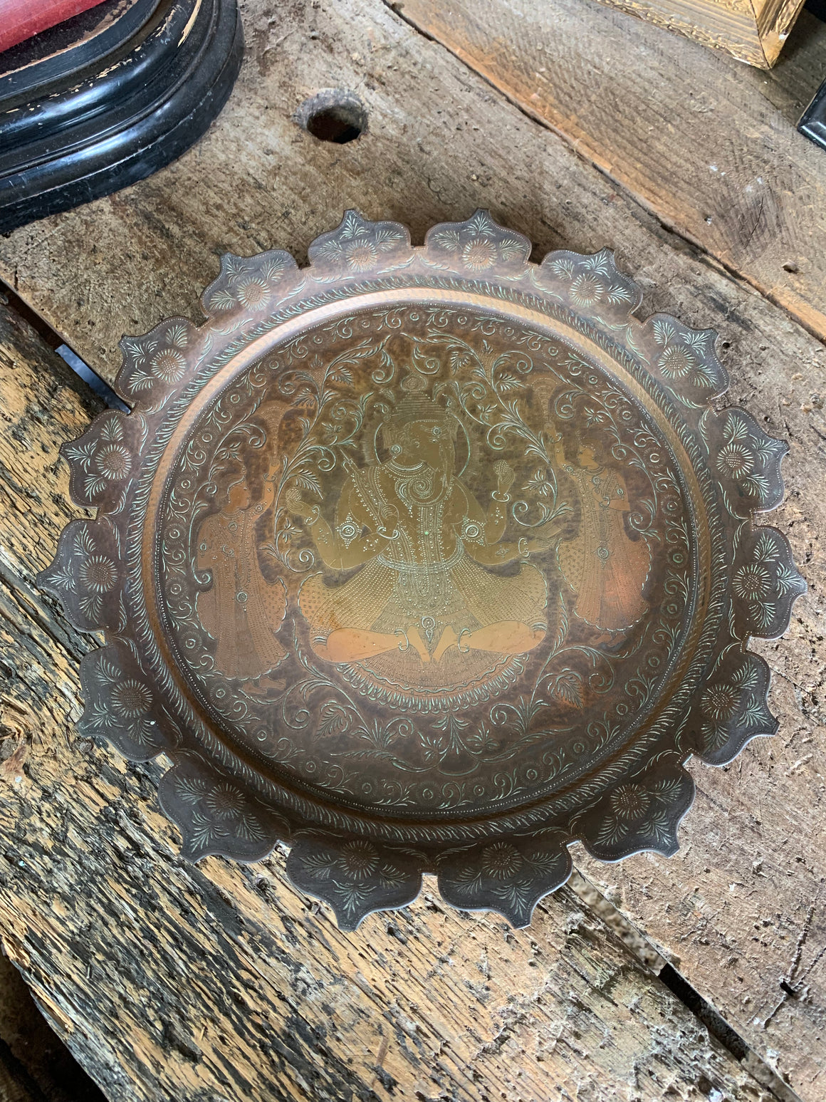 An Indian bronze dish adorned with Ganesha