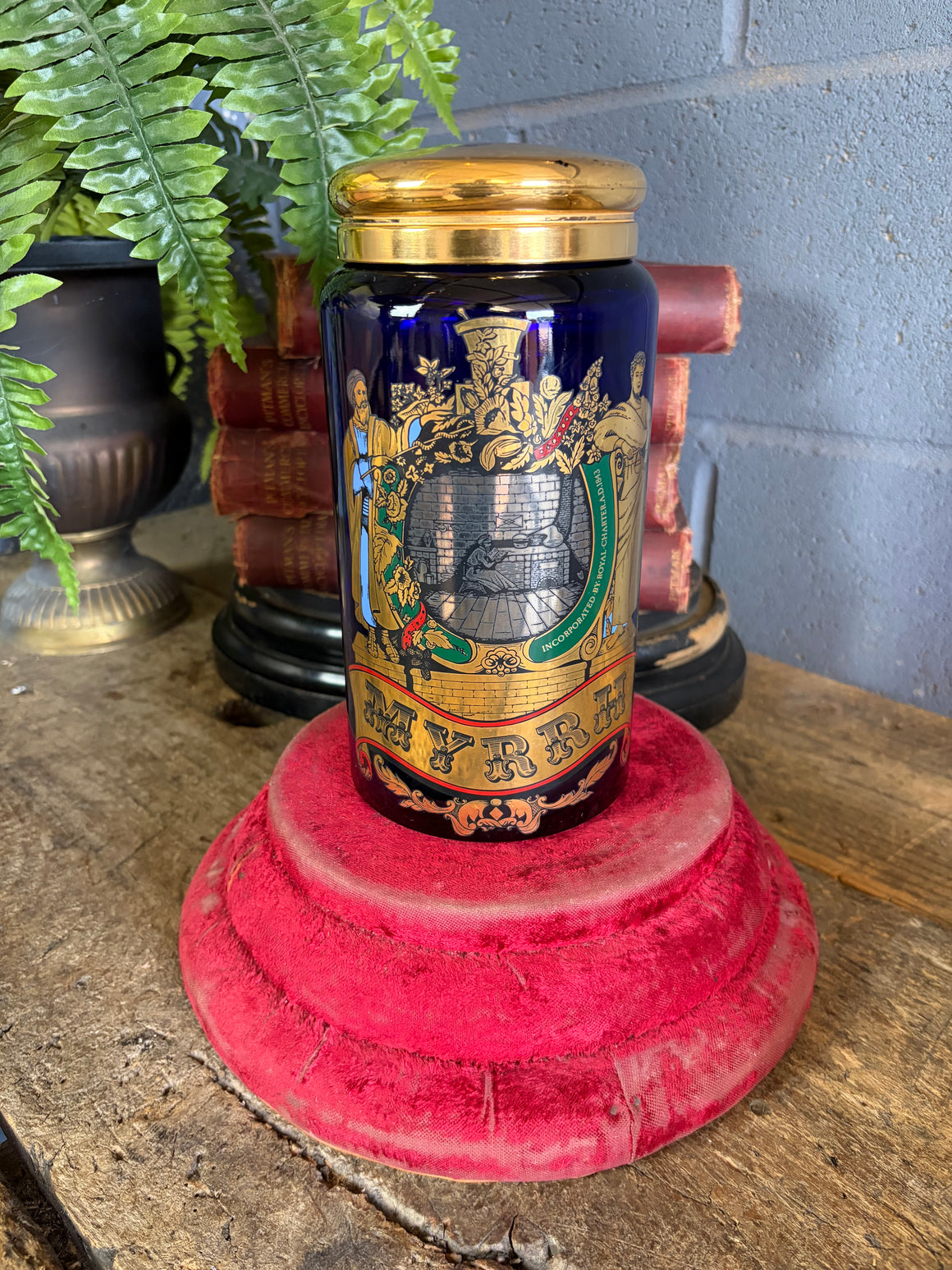 A blue glass myrrh apothecary jar by the Royal Pharmaceutical Society