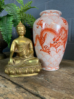 A bronze seated Buddha figure