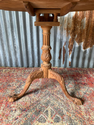 A Georgian style tilt top table with ball and claw feet