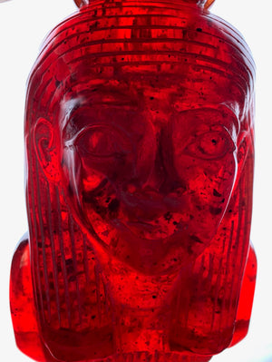 A carved bust of Tutankhamen in red Faturan