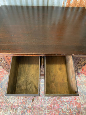 A carved wooden Chinese altar cabinet