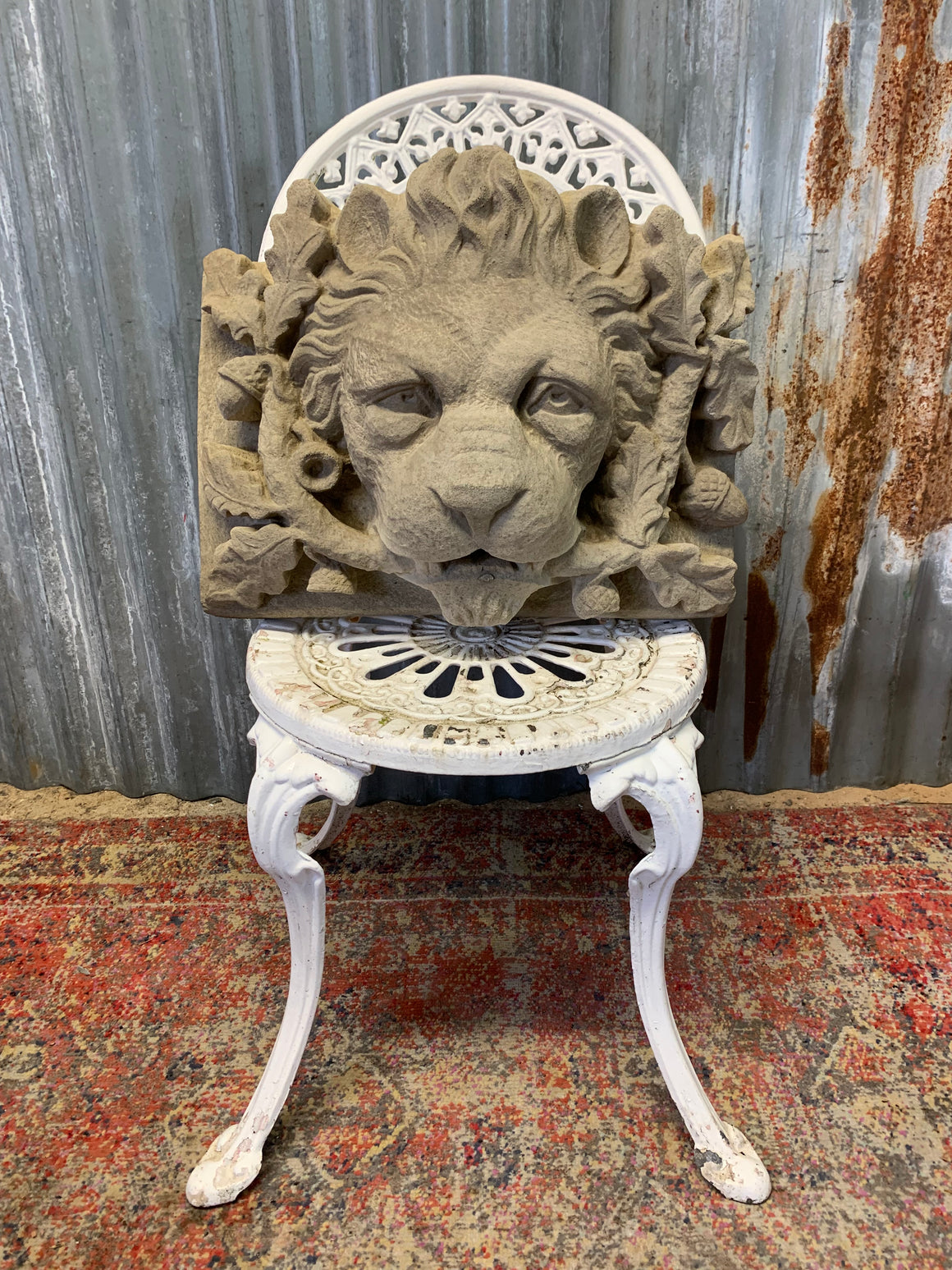 A cast stone lion head with acorns fountain plaque - 45cm