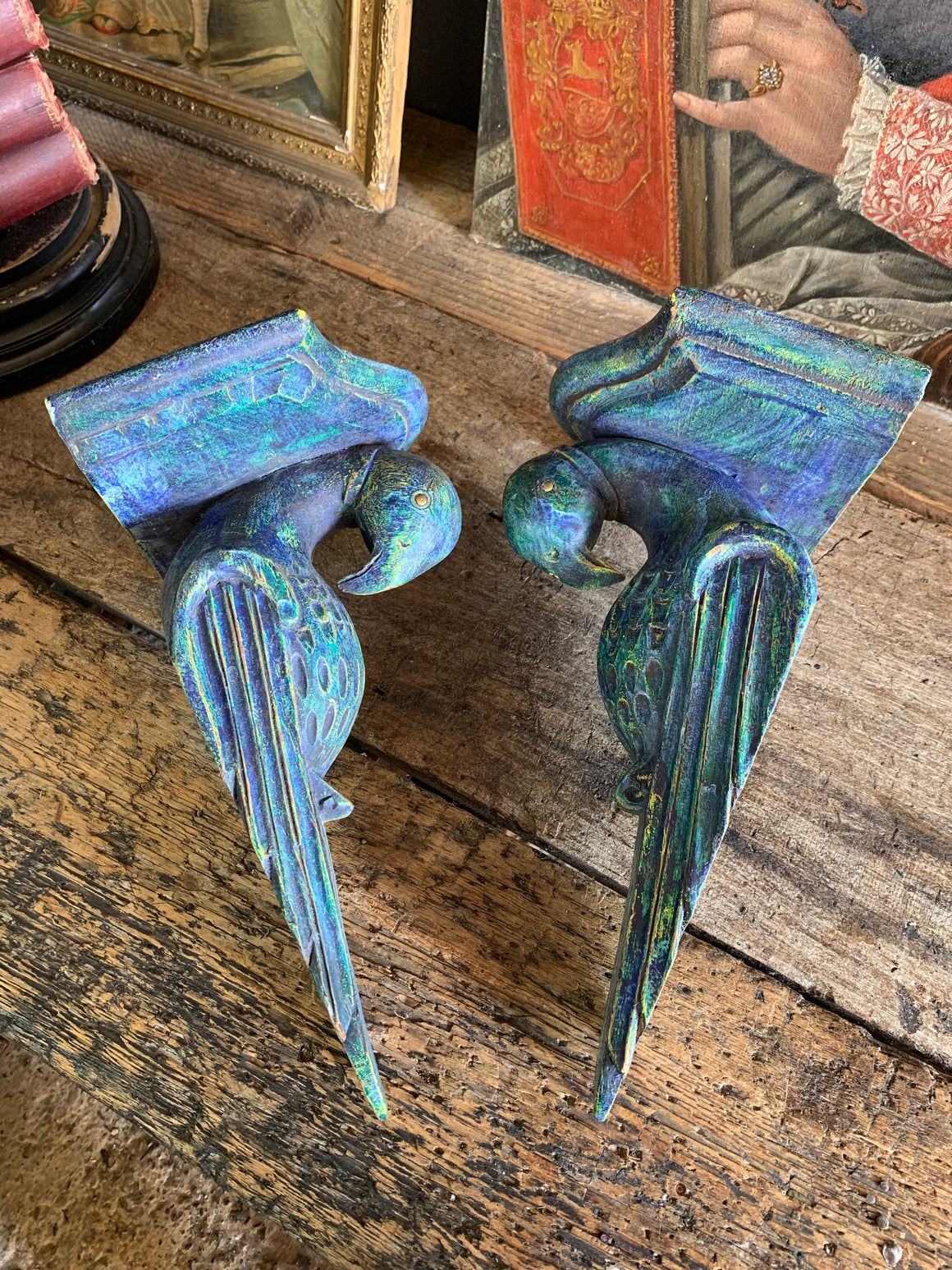 A pair of wooden corbels in the form of parrots