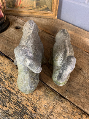 A pair of garden duck figures