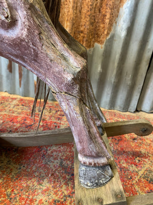 Carved wooden rocking horse