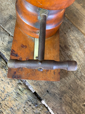 A wooden millinery hat stretcher