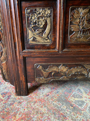 A carved wooden Chinese altar cabinet