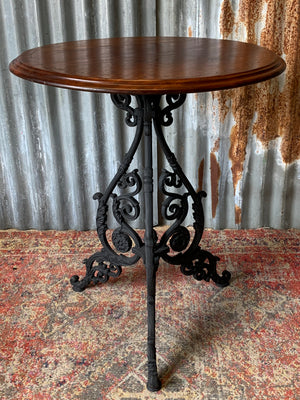 A black cast iron pub table