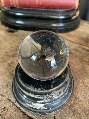 A Victorian crystal ball with box and stand