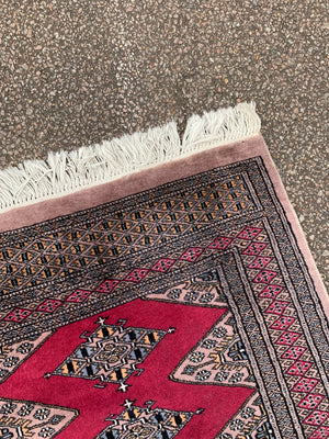 A long pink ground Persian runner rug ~ 318cm x 83cm