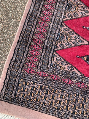 A long pink ground Persian runner rug ~ 318cm x 83cm