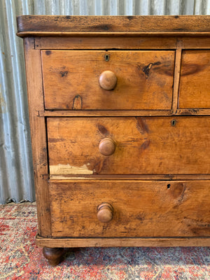 A pine chest of two over two drawers