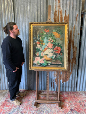 A floor standing and foldable wooden artist's easel