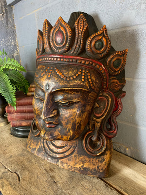 A very large hand-carved bodhisattva head