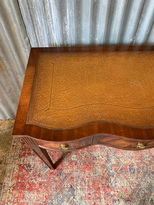 A serpentine desk and leather chair by Bevan Funnell