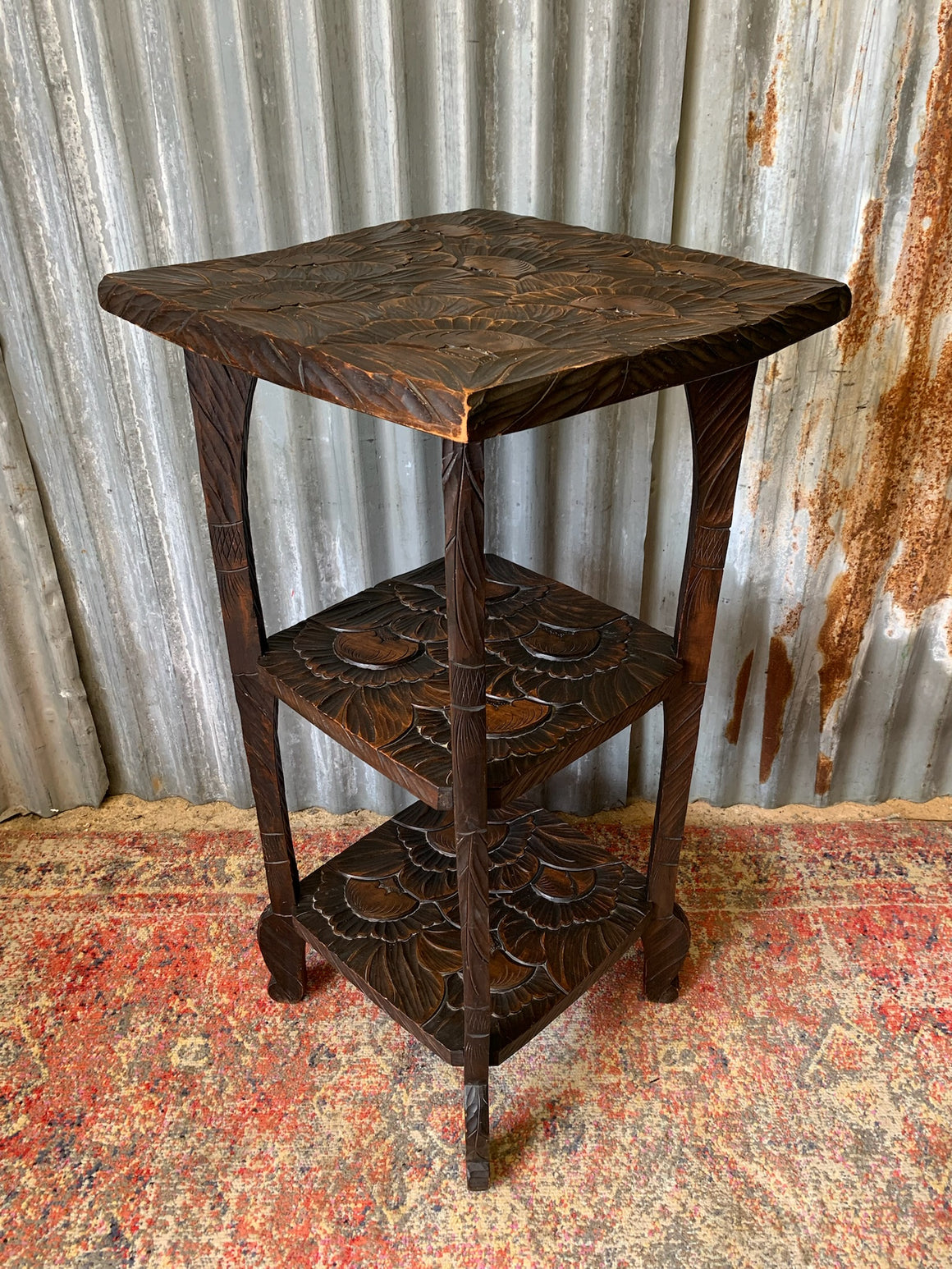 A Japanese carved three tier side table for Liberty London