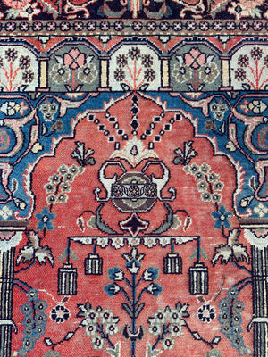A large red ground niche or prayer rug- 202cm x 135cm