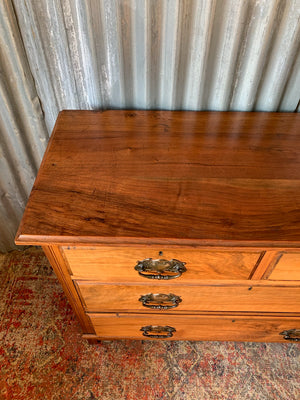 An Art Nouveau chest of drawers
