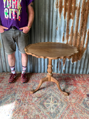 A Georgian style tilt top table with ball and claw feet