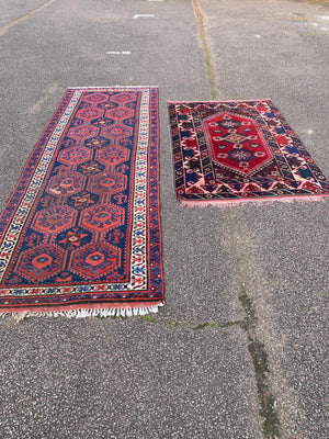 A long red ground blue Persian runner rug ~ 304cm x 104cm