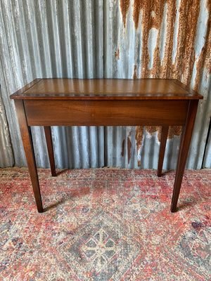 A serpentine desk and leather chair by Bevan Funnell