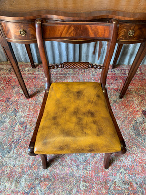 A serpentine desk and leather chair by Bevan Funnell