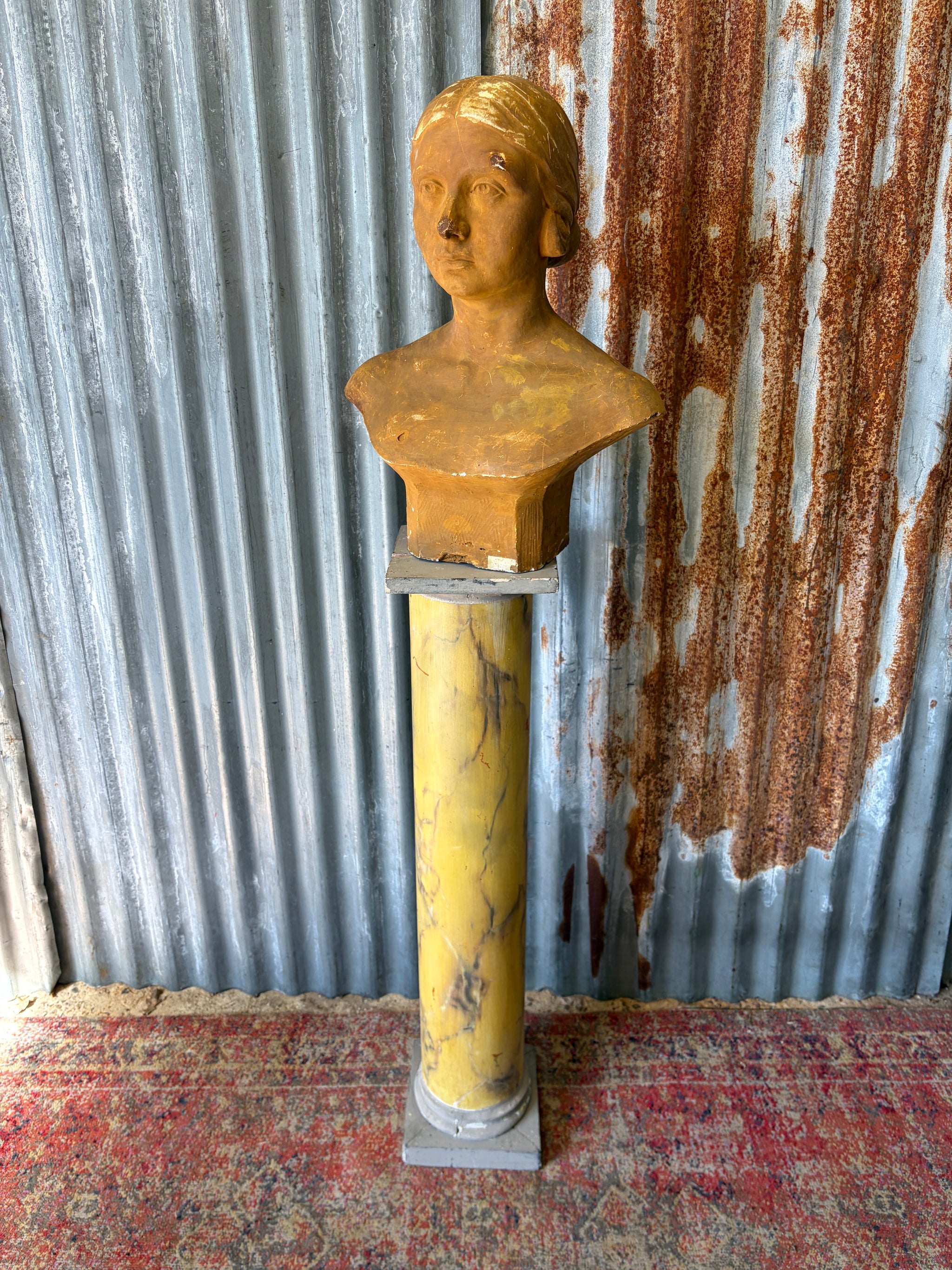 A plaster bust of a woman